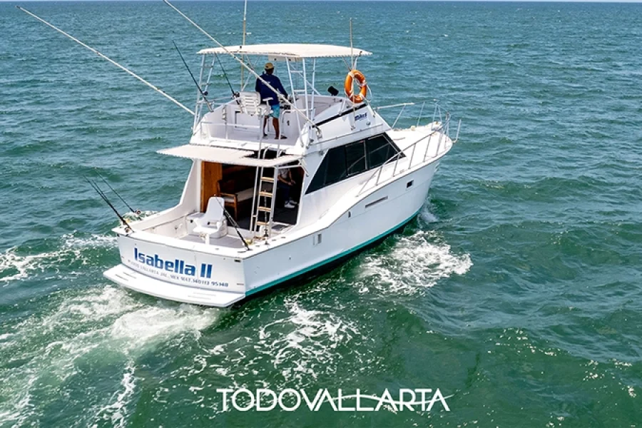 Rear side view of Isabela II with fishing rods visible on the deck.