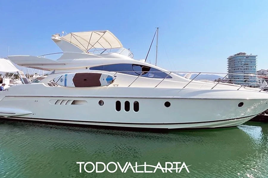 Side view of the yacht Don Joni docked at the marina.