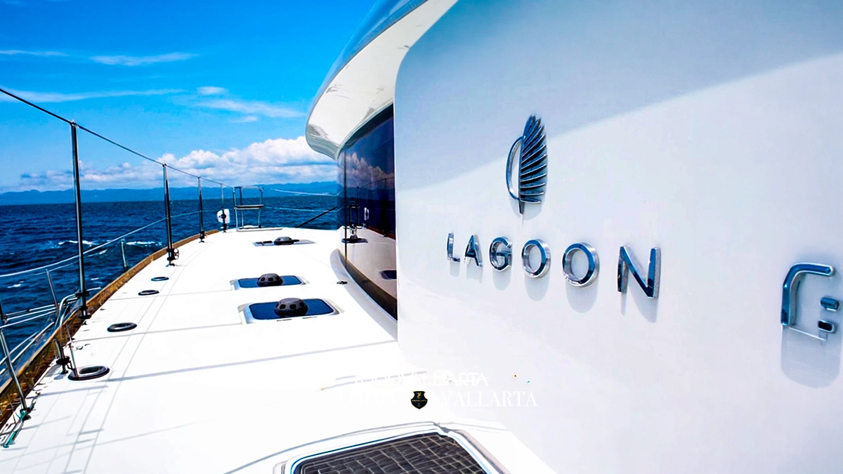 catamaran charter lagoon 45 forward sun pad and netted trampoline with lime-green cushions