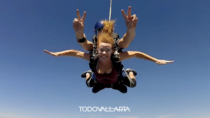 Woman smiling during tandem skydive