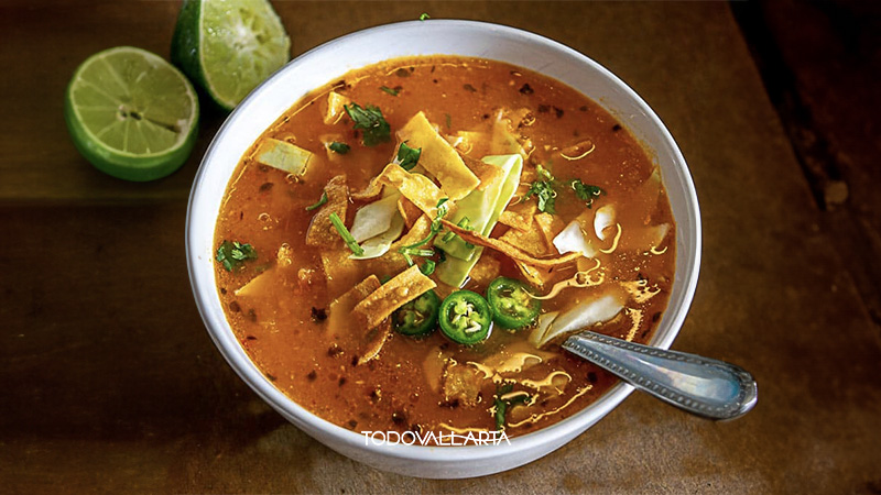 Authentic tortilla soup served in a stone bowl at a cooking class in Puerto Vallarta.