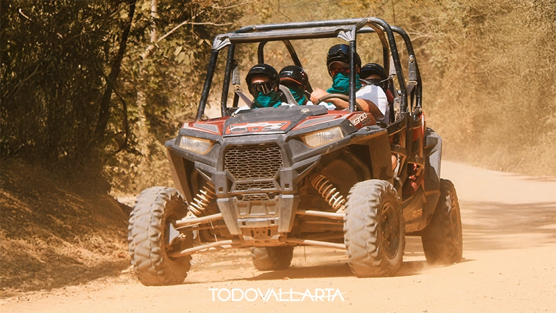RZR off-road vehicle racing through a jungle trail in Puerto Vallarta