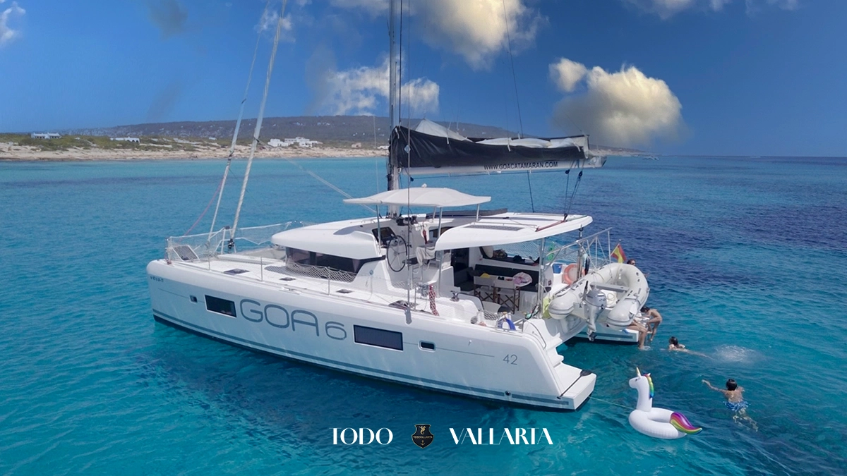 charter goa - 42Ft luxury catamaran anchored in turquoise Banderas Bay with swimmers and inflatable unicorn float