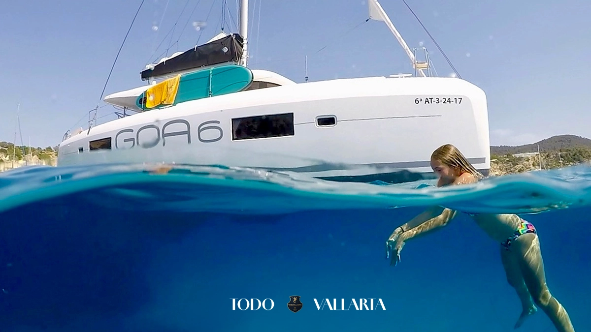 charter goa - 42Ft luxury catamaran hull and snorkeler in crystal-clear Puerto Vallarta waters